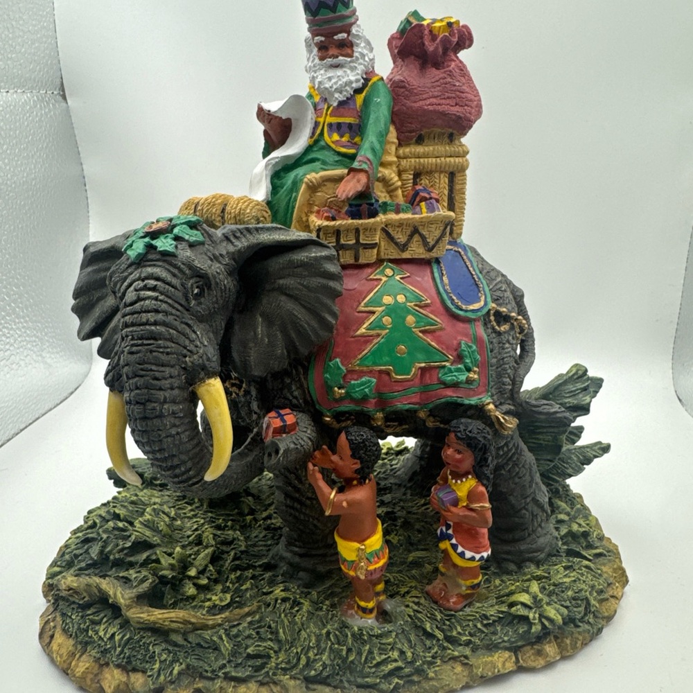 Festive Elephant Figurine with Santa and Children
